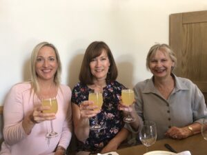 three women with drinks